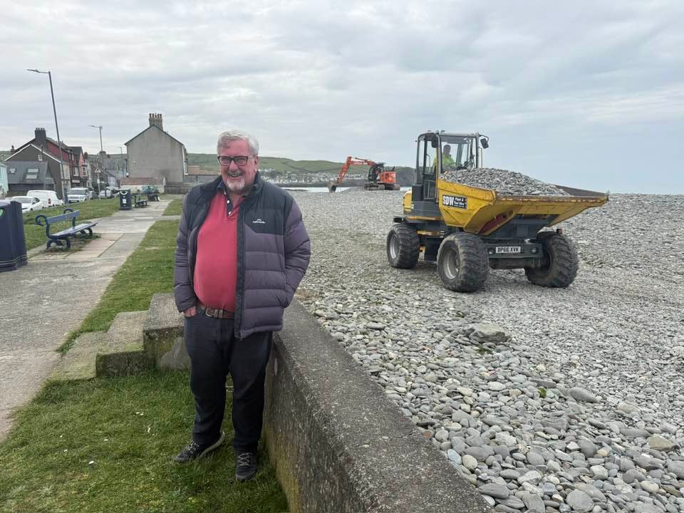 Council workers reprofiling Borth beach visual