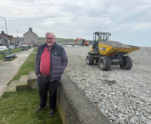 Council workers reprofiling Borth beach