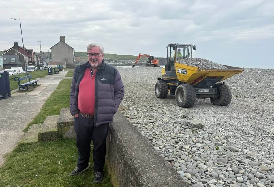 Council workers reprofiling Borth beach