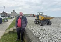 Council workers reprofiling Borth beach