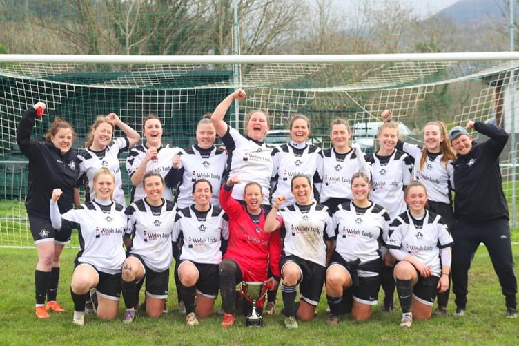 The Pwllheli players celebrate their league cup success