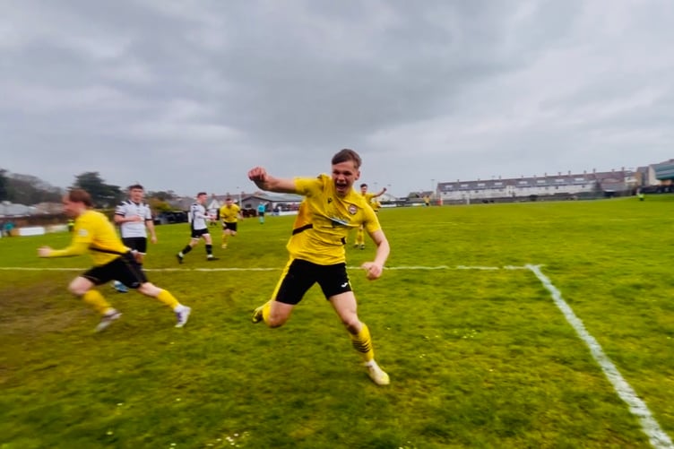 Osian Evans celebrates after equalising for Porthmadog