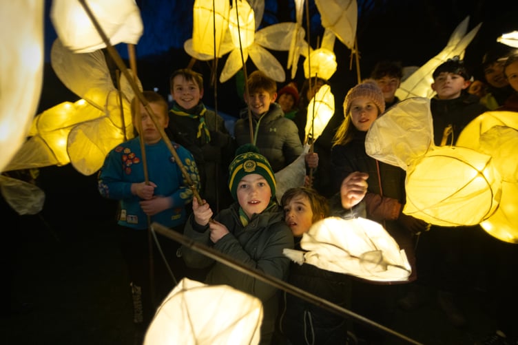 Children took part in a lantern parade under Caban Coch dam.