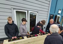 Local learners improve care home garden for residents