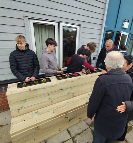  HCT learners and Hafan y Waun residents with the new furniture