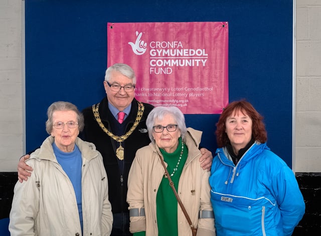 Council Chair Dewi Owen, with ribbon cutters Flora Fowles, 92, and Bronwen Hugill-Gowers, 94, and community council clerk, Sandy Andrews. Photo: Paul Fowles