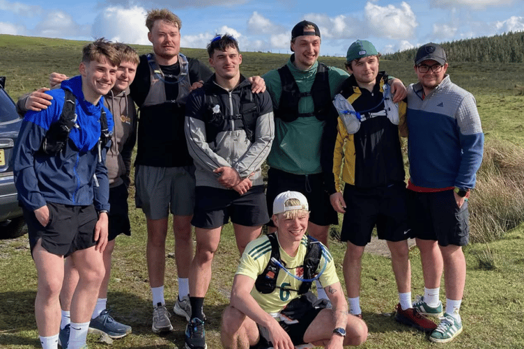 Jensen Jones with his friends running with him during his consecutive 10-marathon challenge. Photo: Jensen Jones