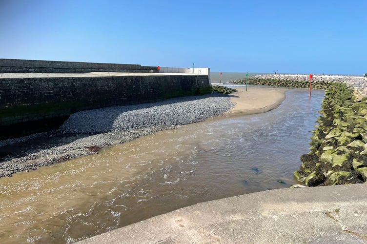 Aberaeron harbour entrance on 30 March, where the build-up of silt has returned despite dredging in early February. Photo: Simon Raw-Rees