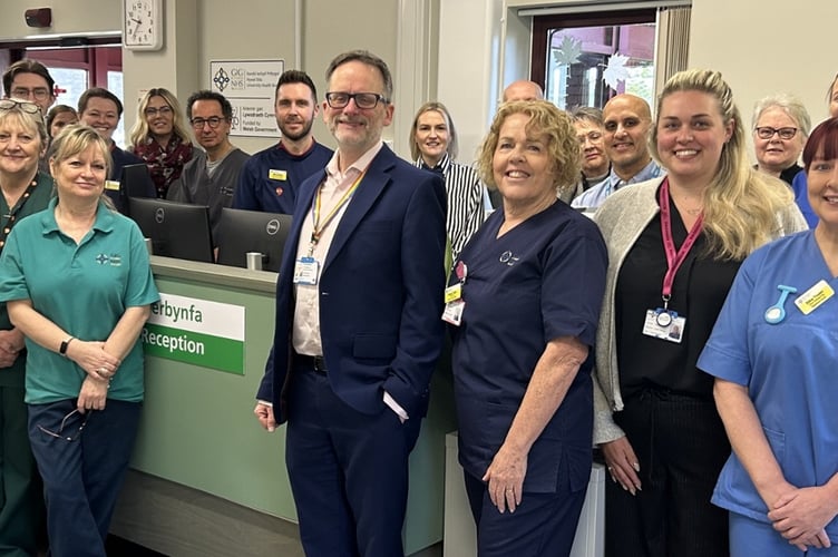Hywel Dda’s Chief Executive Dr Phil Kloer with staff at the refurbished SDEC