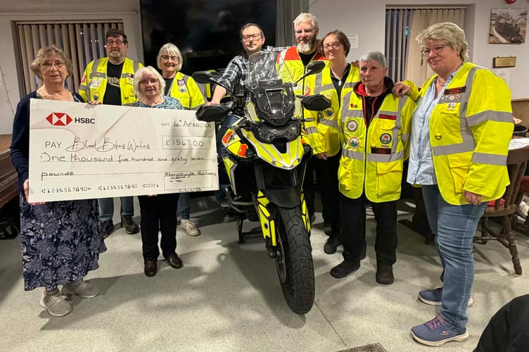 Pictured are Christine Badcock Club Treasurer, Maureen Morgan Club Secretary, Wojciech Gotkowski Club Steward, June Jones Collecting the Cheque on Behalf of Blood Bikes Wales along with Some of the Blood Bikers.