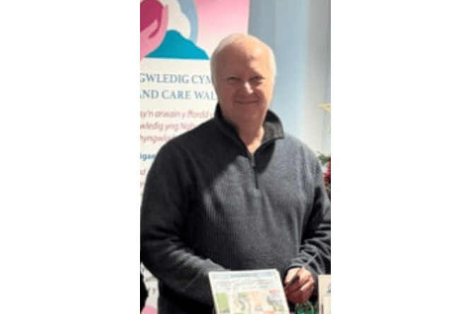 Tywyn Town Clerk Chris Wood, pictured at the Tywyn Wellbeing Walks leaflet launch earlier this year