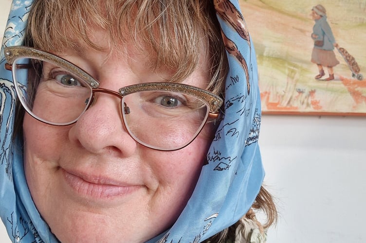 Artist Sue Dewhurst with her “Owd Lasses” paintings in character as one of her Owd Lass paintings, featured in her upcoming exhibition “Lock Up Your Grandads” at The Guildhall, Cardigan until 25 April