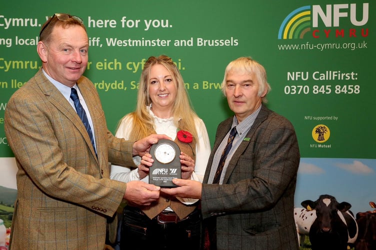 Last year's award-winner, Jess Williams pictured with Bryn Hughes, National Sheep and Beef Specialist for Wynnstay PLC (L) and Hedd Pugh, former NFU Cymru Rural Affairs Board Chair (R).