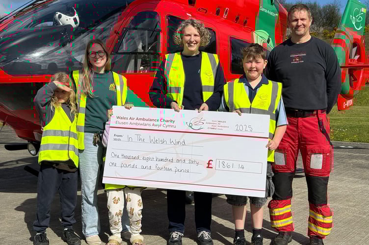Cheque presentation at the Wales Air Ambulance headquarters in Llanelli. Left to Right Wolf Hope, Rebecca Hope, Tor Hope, Ellen Wakelam, Teifi Jungmayr, WAA medic.