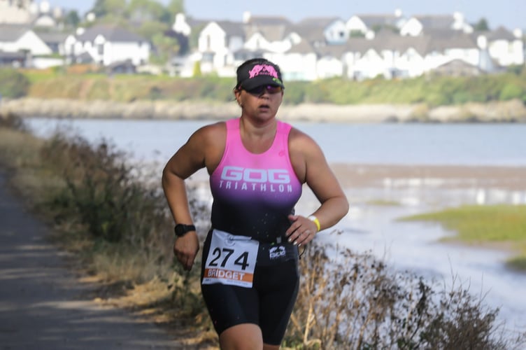 Bridget taking part in a triathlon in 2025