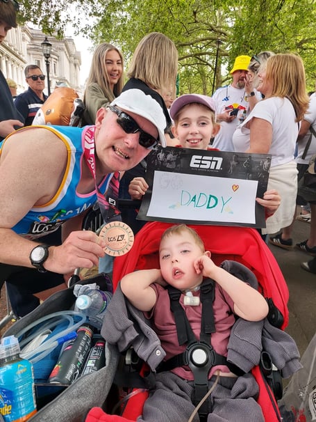 Sean McCarthy was met at the finish by son Theo and other family members. Photo: Hope House Tŷ Gobaith