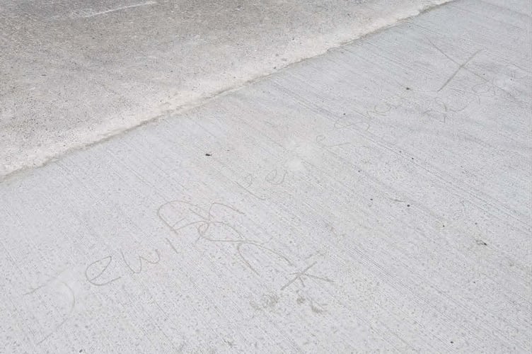 Some of the offensive marks made in the concrete. Photo: Glyn Jones