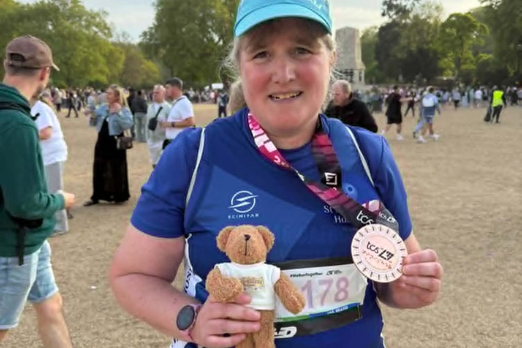 Irene Griffiths celebrating with her medal
