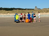 RNLI rescue four paddle boarders blown offshore