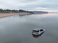 Land Rover Discovery submerged by sea at Abersoch beach