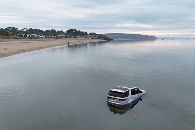 Land Rover Discovery submerged by sea at Abersoch beach