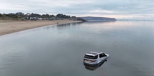 Land Rover Discovery submerged by sea at Abersoch beach