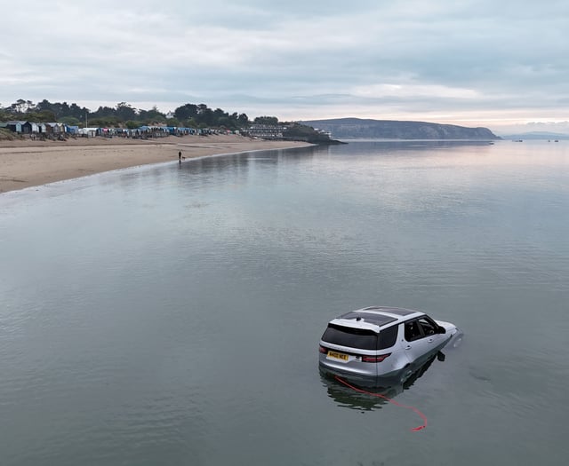 Land Rover Discovery submerged by sea at Abersoch beach