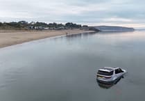 Land Rover Discovery submerged by sea at Abersoch beach