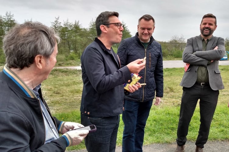 Andy Burnham eating a welsh cake in Blaenavon