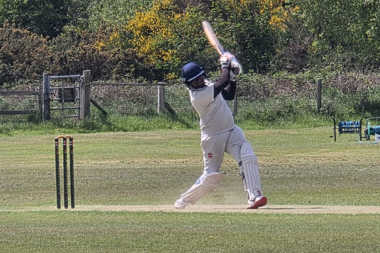Lahiru Chamil drives ferociously past mid-off
