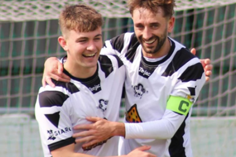 Sion Roberts (left) celebrates with Josua Jones after scoring his second goal