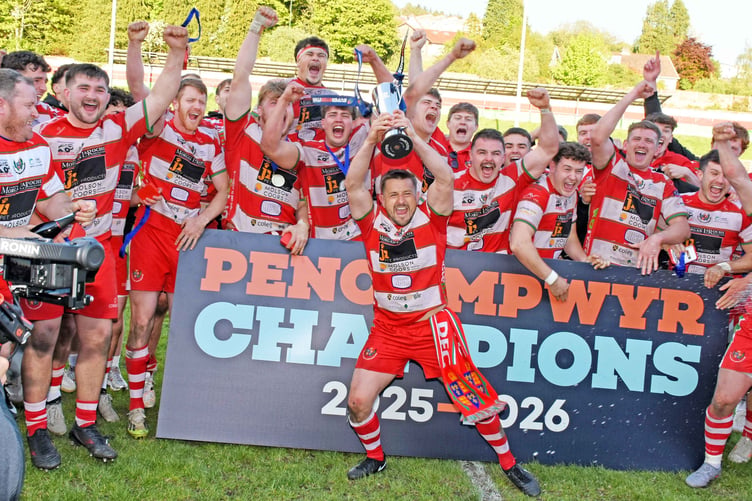 Lee Rees lifts the SRC trophy with the Llandovery team