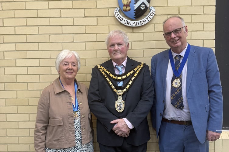 Former Chair, Councillor Ann Bowen Morgan; Chairman of the Council, Councillor John Roberts; Prospective Chair of the Council, Councillor Wyn Evans