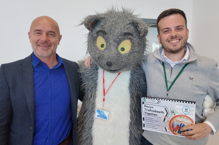Cllr Craig ab Iago, Carys Ofalus, Gwynedd Council road safety character, and Cllr Dewi Jones. Photo: Gwynedd Council