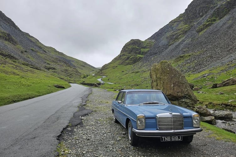 Driving through the Lake District in a classic Mercedes