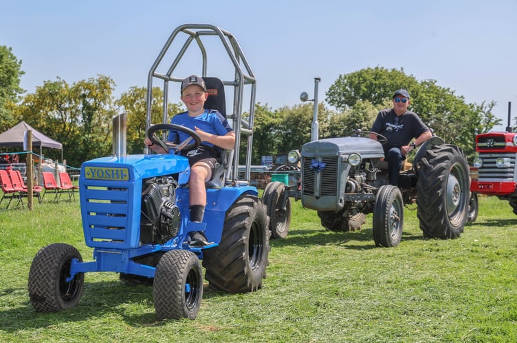 the youngest tractor driver on the field Osian Davies with one of his tractors he took drove on the day