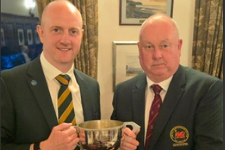 Michael Kavanagh receiving the Celtic Cup from Captain Harri Jones