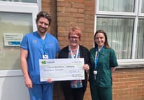 Nurse braves hot coal walk to raise cash for children's services