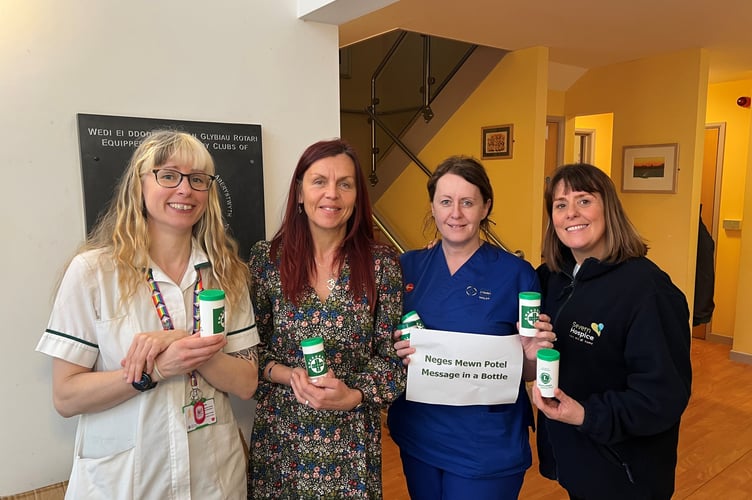 Ceredigion SPCT staff holding the Message in a Bottles