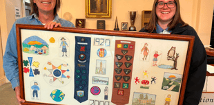 Guides present Mach with picture to celebrate 80th anniversary