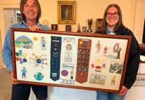 Guides present Mach with picture to celebrate 80th anniversary