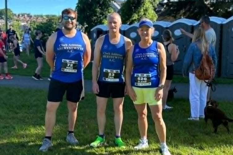Aberystwyth AC Runners Moss Inns, Paul Jones and Elaine Rowlands at the Newtown 10K