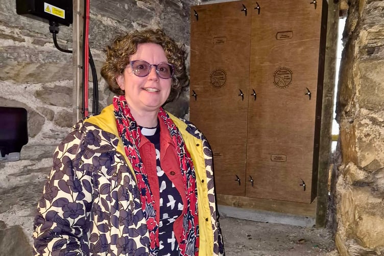 Reverend Miriam Beecroft with the installed swift nest boxes.