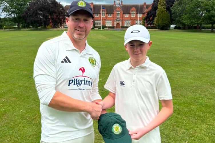 Ted Davies with club captain Daniel Lewis