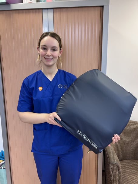 Elin Davies, Colorectal Clinical Nurse Specialist, with a Valley Cushion