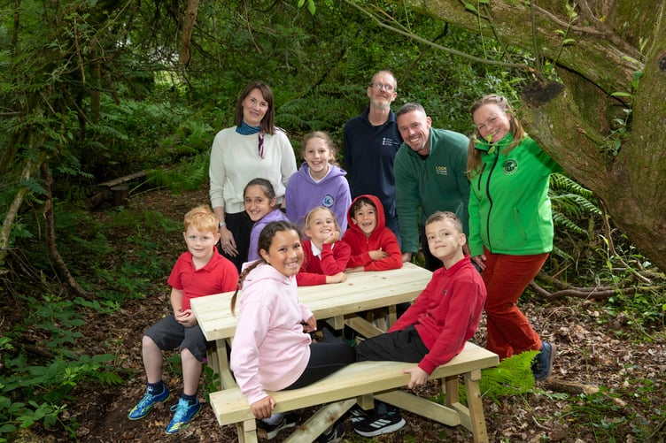 Lock Stock self storage donation to Ysgol Borth-y-Gest, Porthmadog; Pictured are pupils Avelin, Joseph, Oti, Nora, Mared, Kai and Harry along with Headteacher Miss Nia Jones, Hefin Hughes of Blagur Coed, Lee Hanson of Lockstock and Erynne Watson of Ysbrydoli Gan Natur (Inspired By Nature). Picture Mandy Jones