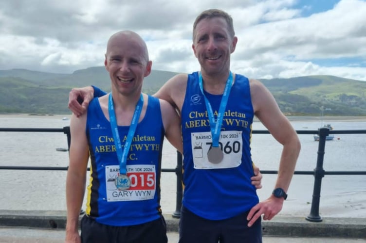 Gary and Owain celebrating their top ten finishes and category wins at Barmouth