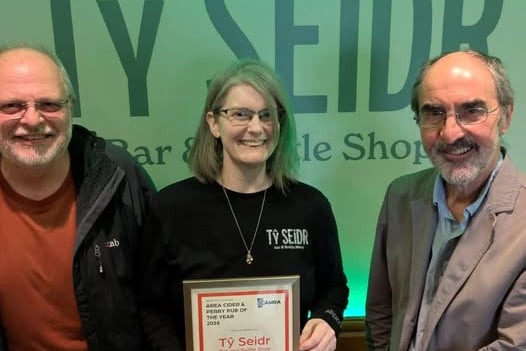 Ceredigion CAMRA Chairman John Gale, Tŷ Seidr owner Ffion Roberts, and West Wales Area Organiser Steve Brady