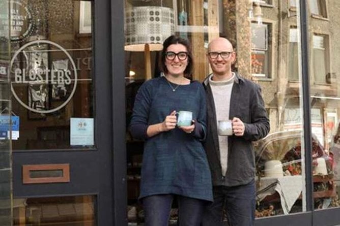 Myfanwy and Tom Gloster outside their Porthmadog shop