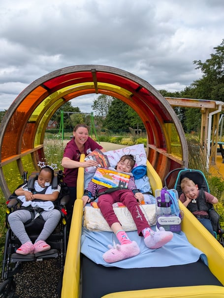 Sarah Danies, Hope House Activities Lead, with children Lwandile, Molly and Theo